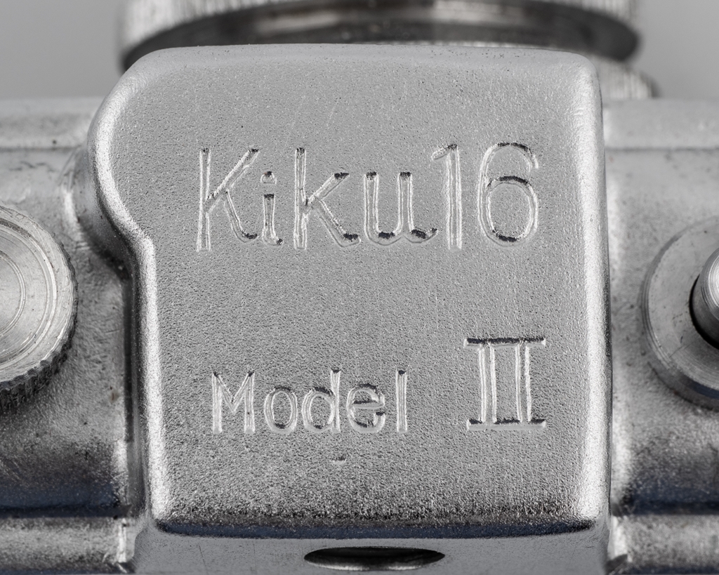A Kiku-16 Mode II miniature camera, with leather case and card box